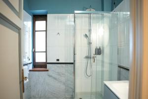 a bathroom with a shower and a sink at Sella&Mosca Casa Villamarina in Alghero +146 photos