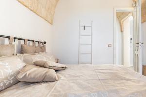 Postel nebo postele na pokoji v ubytování Borgo Dulcedo by Perle di Puglia