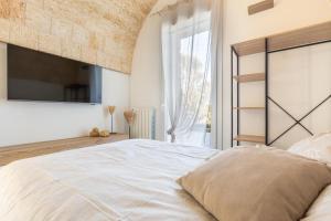 Postel nebo postele na pokoji v ubytování Borgo Dulcedo by Perle di Puglia