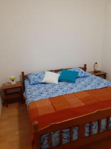 Postel nebo postele na pokoji v ubytování apartmani Ivan & Mirjana 1