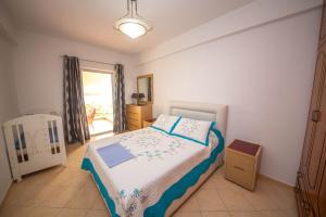 Postel nebo postele na pokoji v ubytování Apartments Cikuli