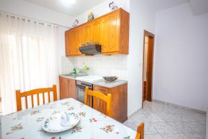 Kuchyň nebo kuchyňský kout v ubytování Apartments Cikuli