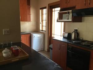 Køkken eller tekøkken på Fully Furnished Pentagon Park