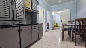 a kitchen with a table and a dining room at Bunut Centre Stay in Bandar Seri Begawan