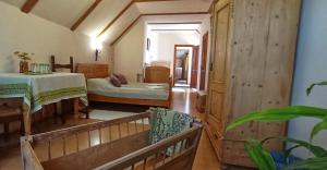 A bed or beds in a room at Vitényi Pince Vendégház