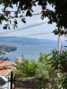 a view of the water from a house at Apartman ENA in Opatija