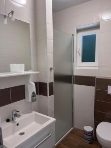 Koupelna v ubytování Rooms & Apartment Mama Mia