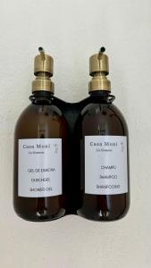 two bottles of soap sitting next to each other at Casa Moni con Vistas al Mar in Playa de Santiago
