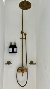 a shower in a bathroom with two bottles on the wall at Casa Moni con Vistas al Mar in Playa de Santiago