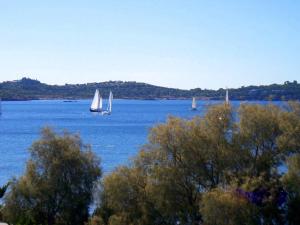 a group of sailboats on a large body of water at Galini Palace in Athens