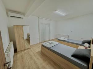 Ένα ή περισσότερα κρεβάτια σε δωμάτιο στο Rooms LikeHome