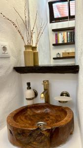 a wooden sink in a bathroom with a shelf at Casa Moni con Vistas al Mar in Playa de Santiago