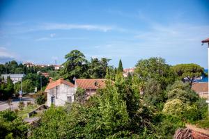 a view of a town with trees and a street at Nonna Marija Nine in Rovinj