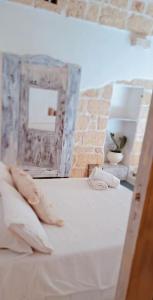 Letto o letti in una camera di Dimore i Messapi Suites Diffuse