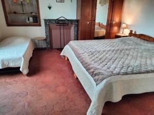 Postel nebo postele na pokoji v ubytování Gite du moulin à la ferme pour 6 á 8 pers tt confort