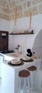 Cucina o angolo cottura di Dimore i Messapi Suites Diffuse