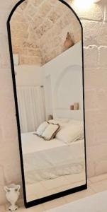 Letto o letti in una camera di Dimore i Messapi Suites Diffuse