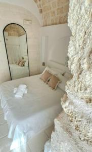 Letto o letti in una camera di Dimore i Messapi Suites Diffuse