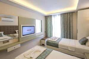 Кровать или кровати в номере Asli Hotel +37 фотографий