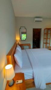 Una cama o camas en una habitación de Aleenka House