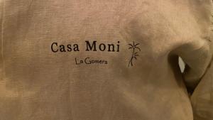 a towel with the words casa mont on it at Casa Moni con Vistas al Mar in Playa de Santiago