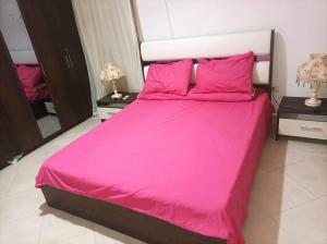 Ένα ή περισσότερα κρεβάτια σε δωμάτιο στο Golf porto marina