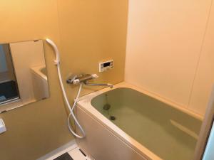 Et badeværelse på The garden inn Osaka Dome + 42 billeder