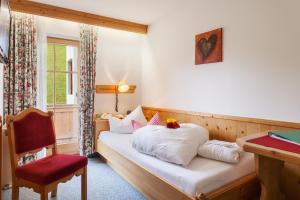 Postel nebo postele na pokoji v ubytování Hotel Garni Hanslerhof " Urlaub am Bauernhof "