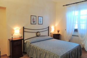 Postel nebo postele na pokoji v ubytování Agriturismo Il Cavallino Saturnia