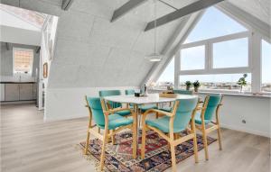 a dining room with a table and chairs at Nice Apartment In Hemmet With Wifi in Hemmet