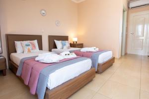 Voodi või voodid majutusasutuse Orchidea Hotel toas