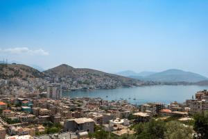 a view of a city and a body of water at Denis Apartments in Sarandë
