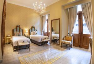 Postel nebo postele na pokoji v ubytování La Concordia - Boutique Hotel
