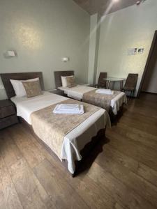 Voodi või voodid majutusasutuse Magic Hotel toas