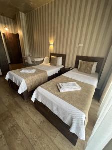 Voodi või voodid majutusasutuse Magic Hotel toas