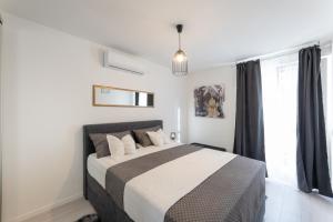 a bedroom with a bed and a window at Apartman Zelic Split in Split