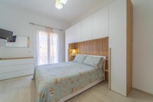 Postel nebo postele na pokoji v ubytování Linfa Guest House - Olbia centro