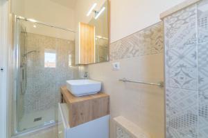 Koupelna v ubytování Linfa Guest House - Olbia centro + 11 fotografií