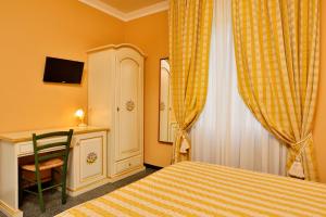A bed or beds in a room at Antica Locanda Luigina