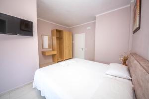 Postel nebo postele na pokoji v ubytování Blu Horizon Hotel Gjipe