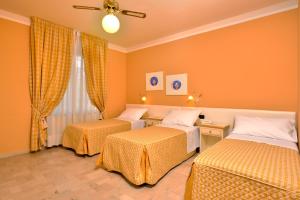 A bed or beds in a room at Antica Locanda Luigina
