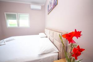 Postel nebo postele na pokoji v ubytování Blu Horizon Hotel Gjipe