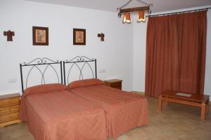Postel nebo postele na pokoji v ubytování Hotel Juan Francisco