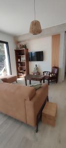 a living room with a couch and a table at Casa di Cortanni in Castellare-di-Casinca