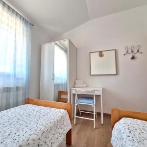 Posteľ alebo postele v izbe v ubytovaní Apartment Mita