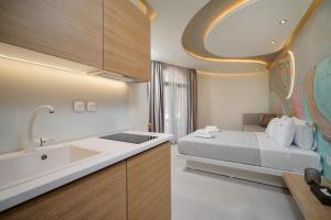 Postel nebo postele na pokoji v ubytování Moderi Luxury Suites + 102 fotografií