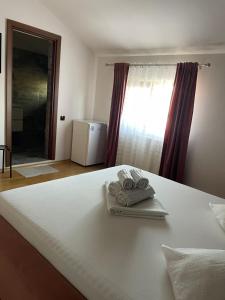 Postel nebo postele na pokoji v ubytování Vila Anir