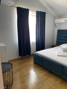 Postel nebo postele na pokoji v ubytování Vila Anir