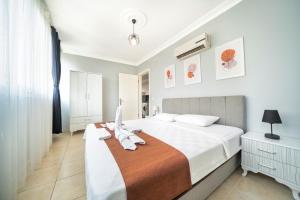 Postel nebo postele na pokoji v ubytování MASAL APART HOTEL