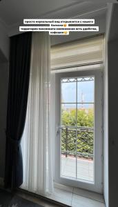 Balkón nebo terasa v ubytování Коттедж Иссык Куль + 3 fotografie